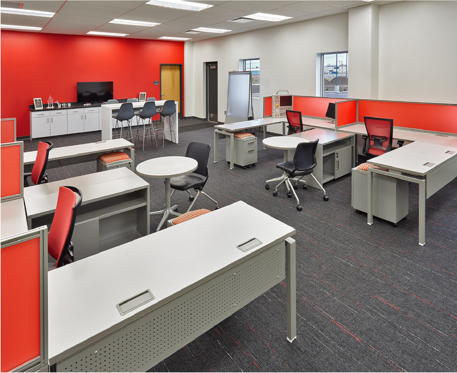 A room displaying a variety of desking and bench solutions.